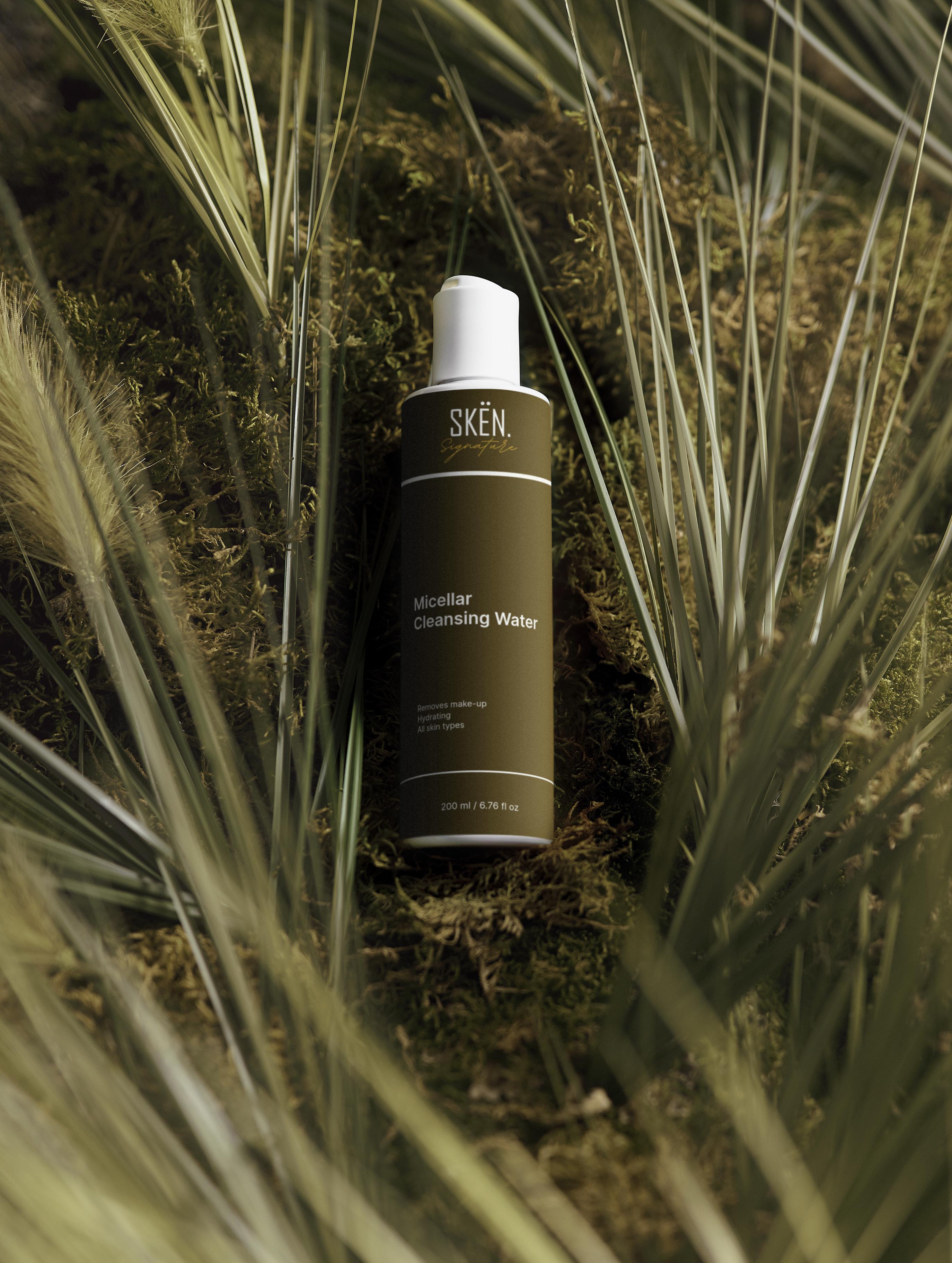 Skén bottle of micellar cleansing water surrounded by grass and plants